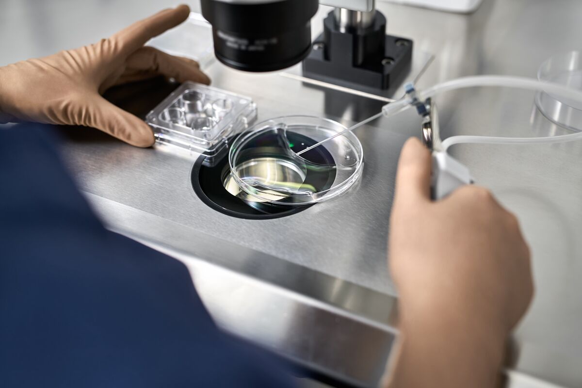 Shows a lab worker conducing a test