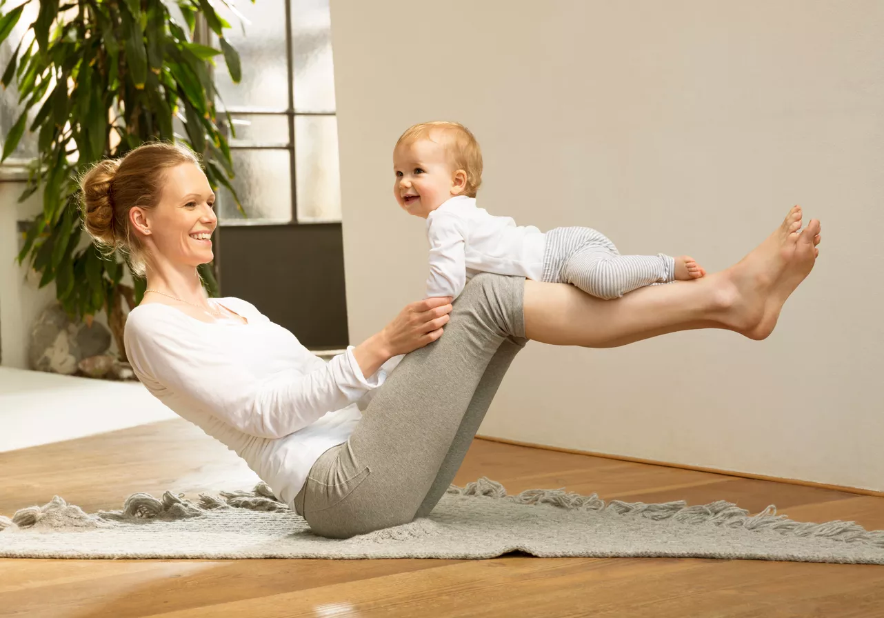 woman balancing baby on her legs 2022 12 16 22 42 46 utc 1282 x 896