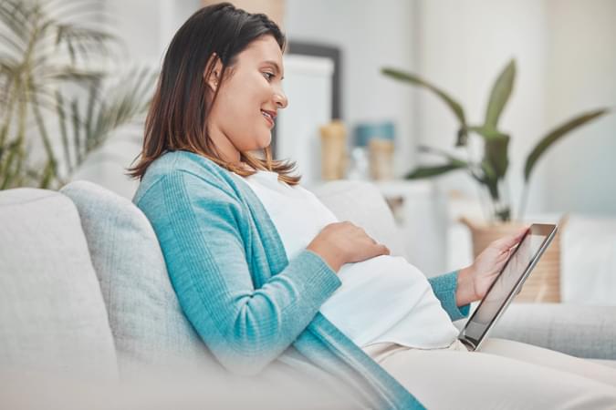 pregnancy-planning-relax-and-woman-with-a-tablet-2022-12-29-23-07-18-utc