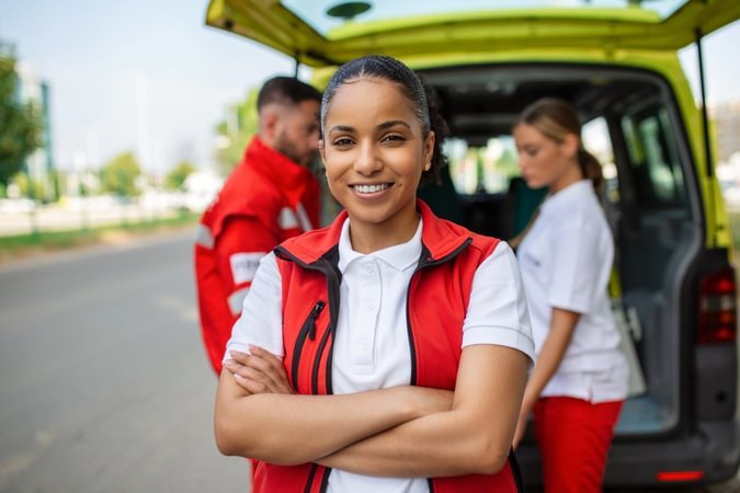 Emergency response worker with folded arms